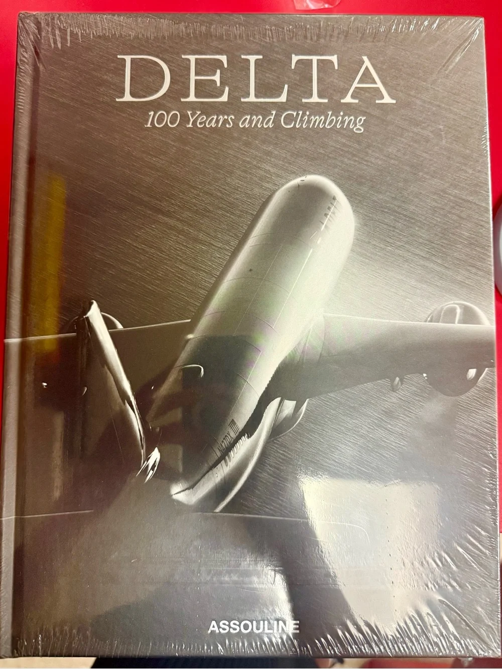 Delta: 100 Years & Climbing Coffee Table Book by Assouline